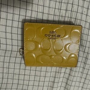 Coach Embossed Yellow Wallet